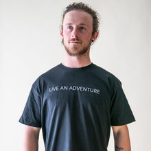 Load image into Gallery viewer, male model wearing Glacier Raft Company live an adventure t-shirt