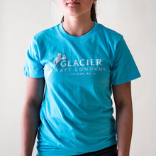 Load image into Gallery viewer, Teal t-shirt with Glacier Raft Company Golden BC Logo