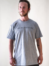 Load image into Gallery viewer, model wearing grey live an adventure glacier rafting t-shirt