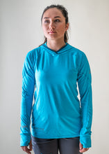 Load image into Gallery viewer, model wearing NRS blue silkweight women's hoodie
