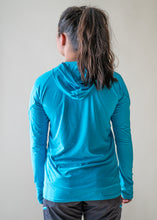 Load image into Gallery viewer, model showing back of NRS women's silkweight hoodie