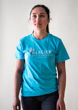 Load image into Gallery viewer, female model wearing teal glacier raft company logo t-shirt