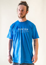 Load image into Gallery viewer, male model wearing blue glacier raft company logo t-shirt