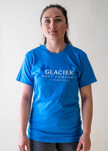 Load image into Gallery viewer, female model wearing blue glacier raft company logo t-shirt