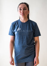 Load image into Gallery viewer, female model wearing navy glacier raft company logo t-shirt