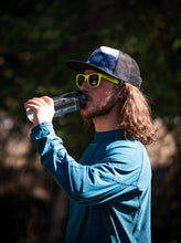 Load image into Gallery viewer, guy drinking from a glacier raft company glass water bottle