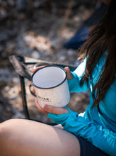 Load image into Gallery viewer, enjoying a beverage from our glacier raft company mug