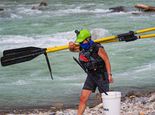 Load image into Gallery viewer, Glacier Raft Company guide wearing women's NRS guide shorts