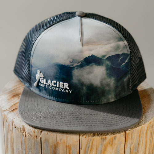 grey and white mountain scenery glacier raft company hat