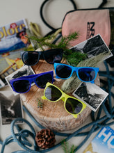 Load image into Gallery viewer, glacier raft company sunglasses in black, blue, purple and yellow

