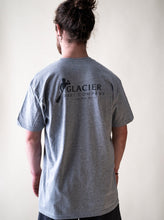 Load image into Gallery viewer, model showing back of grey live an adventure t-shirt
