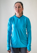 Load image into Gallery viewer, model wearing NRS blue silkweight women&#39;s hoodie
