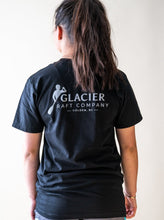 Load image into Gallery viewer, model showing back of glacier raft company black t-shirt
