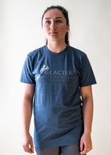 Load image into Gallery viewer, female model wearing navy glacier raft company logo t-shirt

