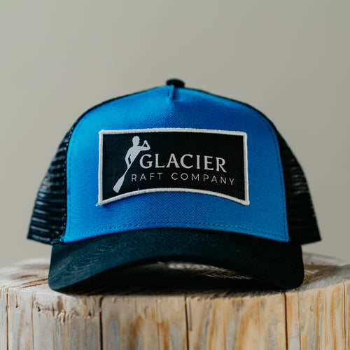 royal blue and black Glacier Raft Company hat